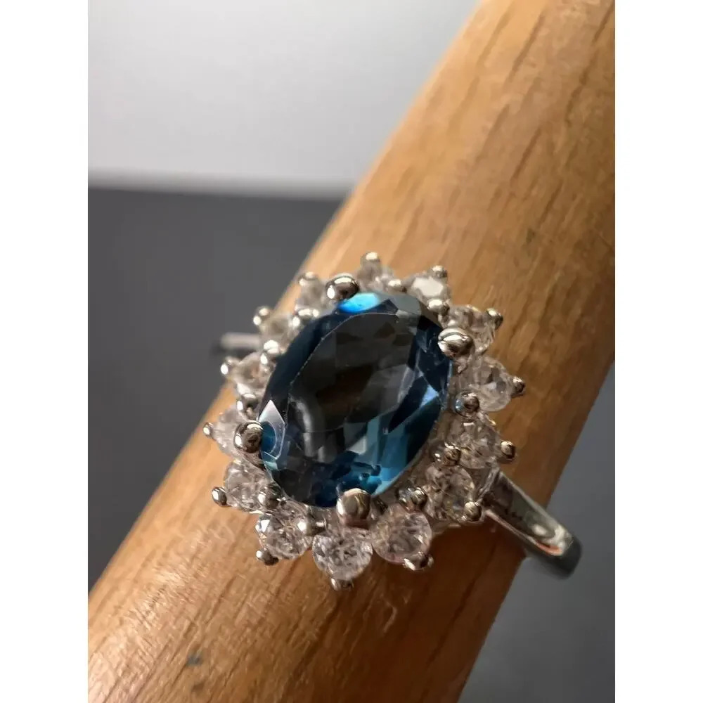 London blue topaz halo ring in platinum over sterling silver. ctw 1.40 size 5